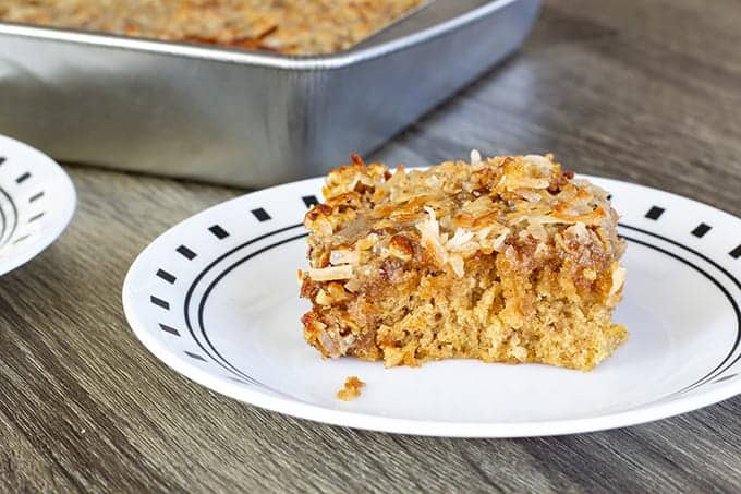 Oatmeal Cake with Coconut Pecan Topping features old fashioned oats. It is dense and moist and topped with a delicious ooey-gooey coconut pecan topping!