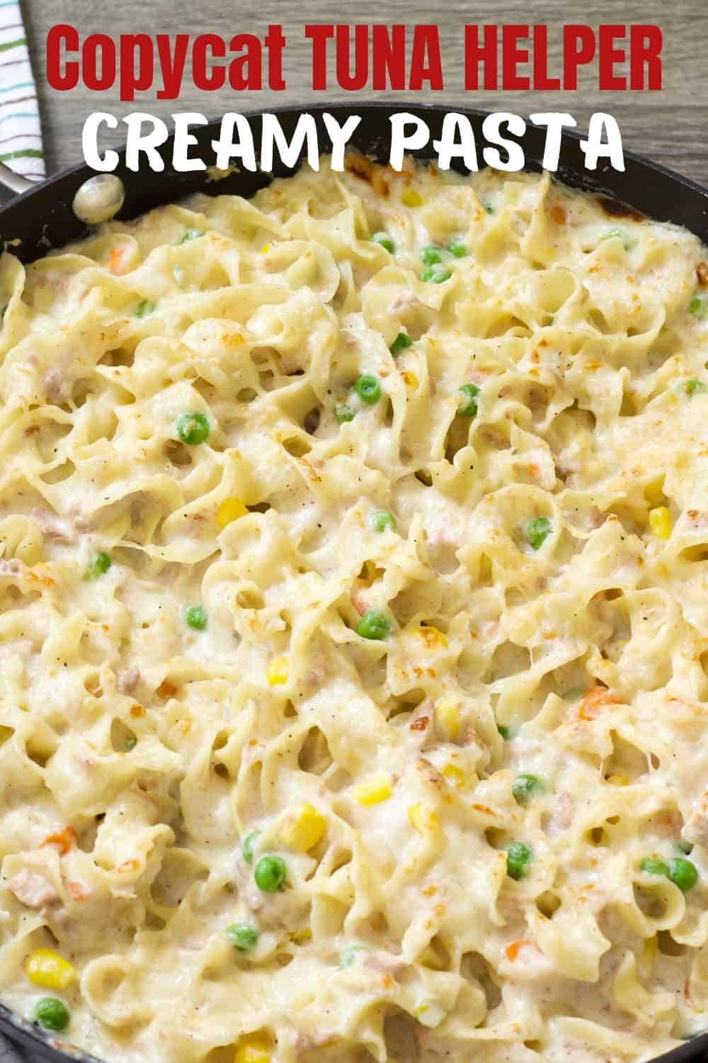 Overhead close up shot of a copycat recipe of skillet of cheesy tuna noodles with title.