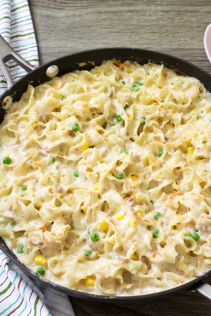 Overhead close up shot of a skillet of homemade tuna noodle casserole.