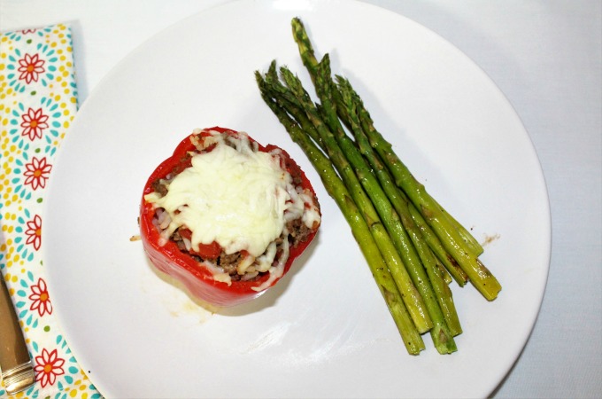 Stuffed Bell Peppers are flavorful and filling. It is an impressive dish that is easy to make. Ground beef, tomatoes and cheese give it great flavor. 