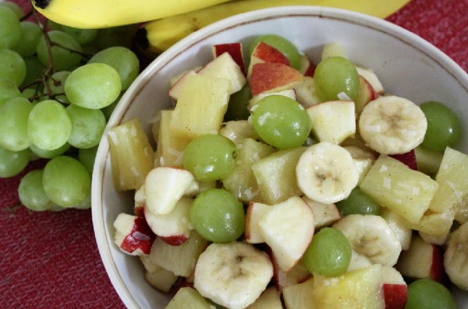 This is a refreshing fruit salad that combines canned pineapple, fresh apples and grapes with coconut and honey with a dash of cinnamon. It is very flavorful.