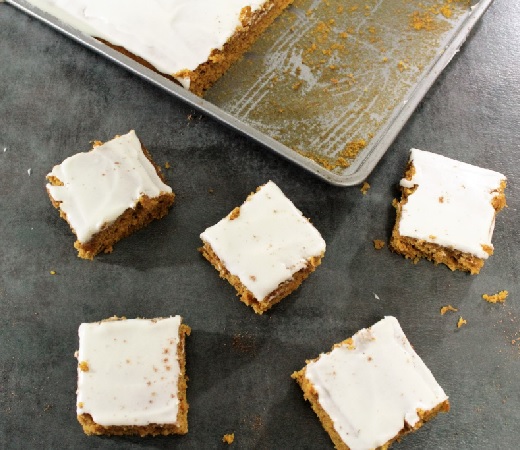 White flour combined with wheat flour as well as yogurt in the frosting make this recipe for Pumpkin Sheet Cake a little healthier than traditional recipes.