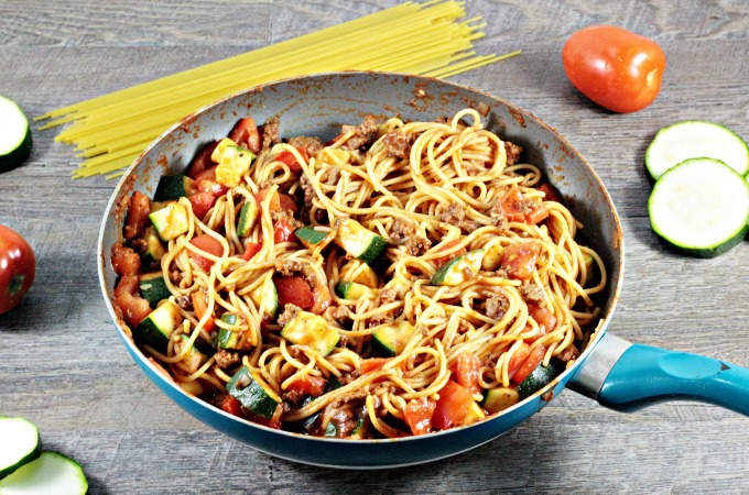 Spaghetti with Zucchini & Tomatoes combines pasta, ground beef, onions, tomato sauce, seasonings, zucchini, and tomatoes. It is fast and healthy.