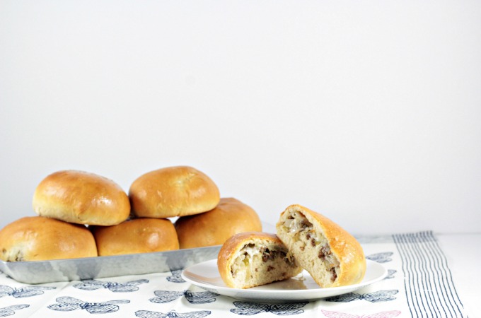 Bierocks are a soft yeast dough pastry sandwich filled with cabbage, ground beef, onion, and cheese. This dish is popular among the German community.