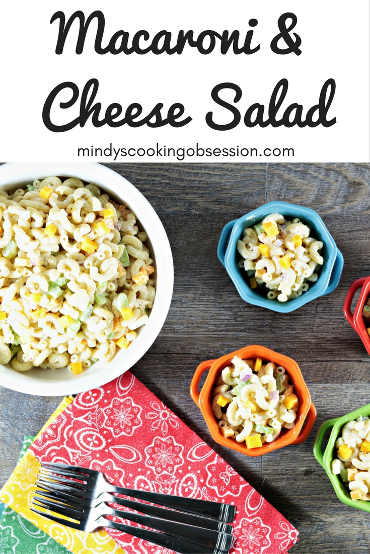 Macaroni & Cheese Salad combines elbow macaroni, cheese cubes, celery, red onion, Dijon mustard, mayo, sour cream, salt, pepper, and sugar. 