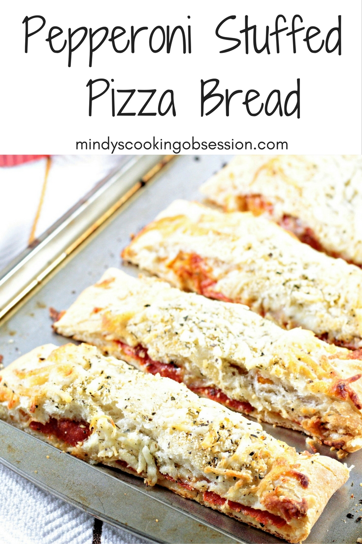 Pepperoni Stuffed Pizza Bread features premade crust, sauce, pepperoni, mozzarella & Parmesan cheese, Italian seasoning, and garlic powder. Easy and quick.