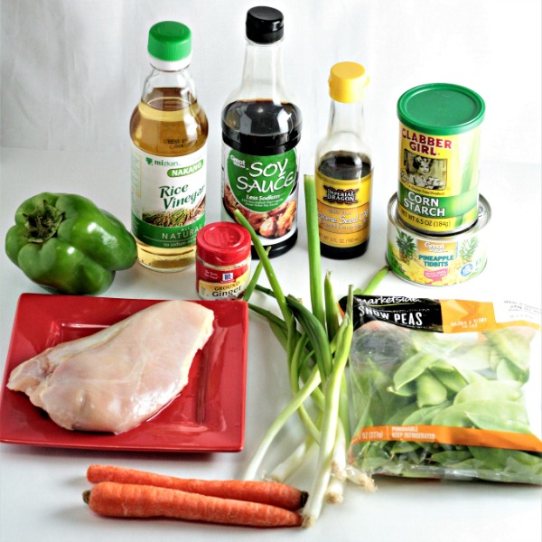 Pineapple Chicken Stir Fry combines chicken, carrots, bell peppers, snow peas, pineapples and juice, soy sauce, and broth. Healthy, quick and delicious!