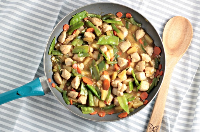 Pineapple Chicken Stir Fry combines chicken, carrots, bell peppers, snow peas, pineapples and juice, soy sauce, and broth. Healthy, quick and delicious!