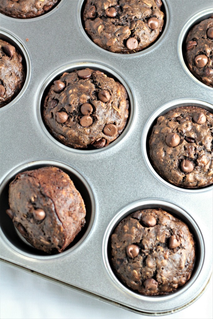 Double Chocolate Banana Oatmeal Muffins have oats, cocoa, buttermilk, applesauce, and chocolate chips. They are chocolatey, moist, easy, and quick. 