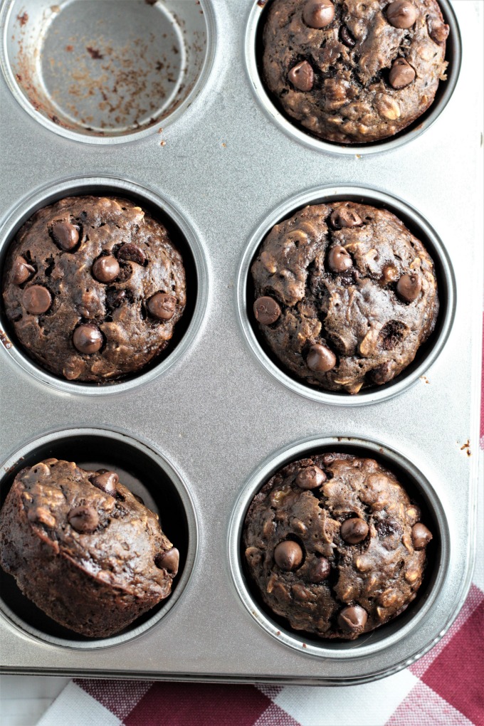 Double Chocolate Banana Oatmeal Muffins have oats, cocoa, buttermilk, applesauce, and chocolate chips. They are chocolatey, moist, easy, and quick. 