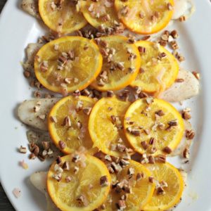 Pan Fried Fish with Oranges and Pecans features white fish, shallots, white wine vinegar, orange juice, and butter. A quick, easy, and healthy dish.