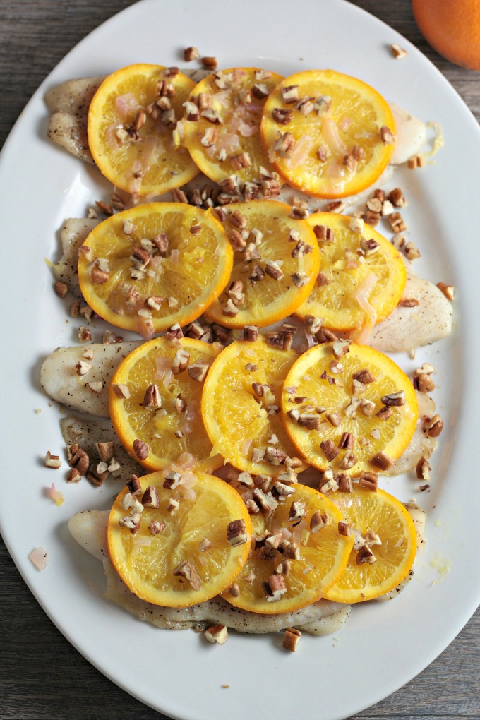 Pan Fried Fish with Oranges and Pecans features white fish, shallots, white wine vinegar, orange juice, and butter. A quick, easy, and healthy dish. 