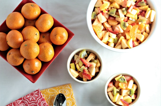 Refreshing Winter Fruit Salad features red and green apple, kiwi, strawberry, pineapple, and mandarin oranges topped with a honey lemon dressing. Healthy!