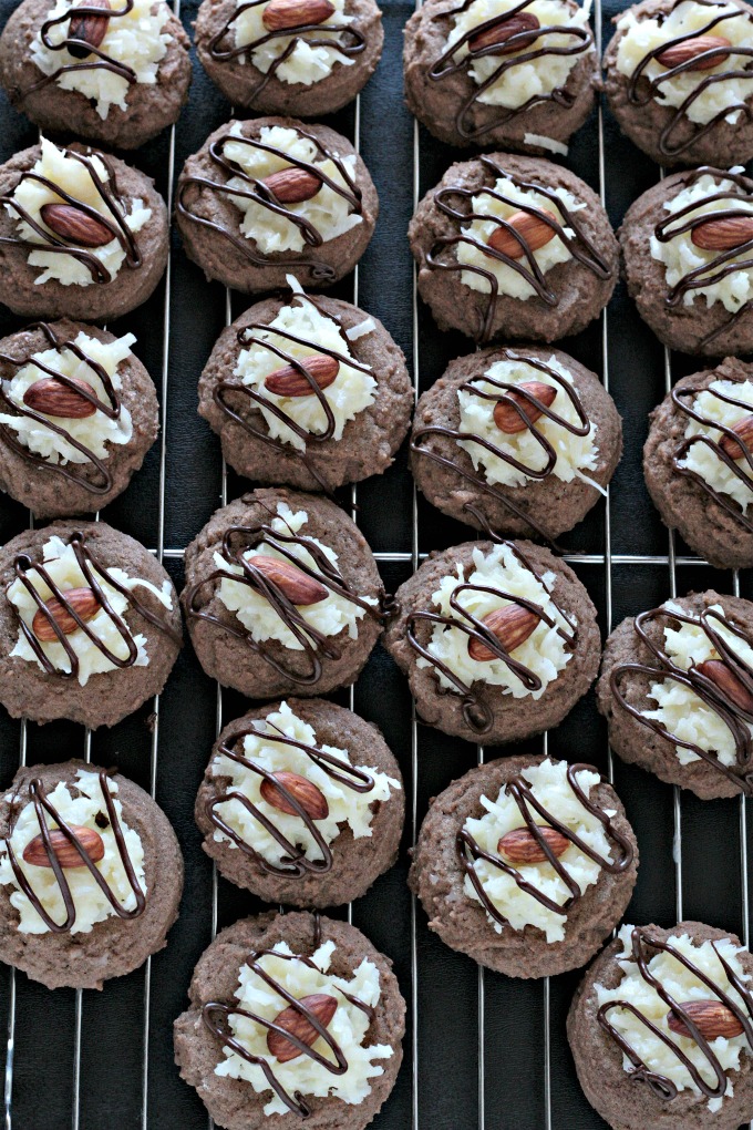 Almond Joy Cookies feature a light and fluffy chocolate cookie baked to perfection, topped with sweet gooey coconut candy then drizzled with chocolate. 