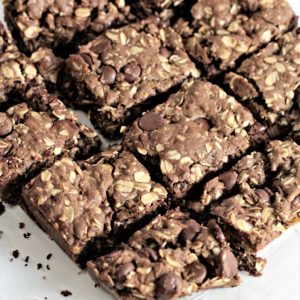 Chocolate Chocolate Chip Oatmeal Bars feature cocoa, oats, and chocolate chips to make this rich, dense and delicious cookie bar.