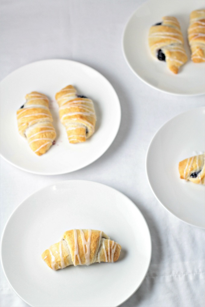 Blackberry Crescent Roll Turnovers are so yummy! All you need is store bought crescent rolls, pie filling, powdered sugar and milk to make this easy treat.