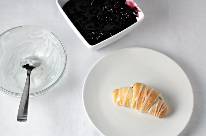 Blackberry Crescent Roll Turnovers are so yummy! All you need is store bought crescent rolls, pie filling, powdered sugar and milk to make this easy treat.