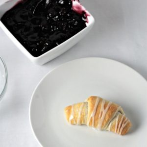 Blackberry Crescent Roll Turnovers are so yummy! All you need is store bought crescent rolls, pie filling, powdered sugar and milk to make this easy treat.