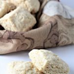 Super Easy Buttermilk Biscuits combine flour, buttermilk, grated butter, sugar, baking powder, baking soda and salt. Brush with milk and bake to perfection!