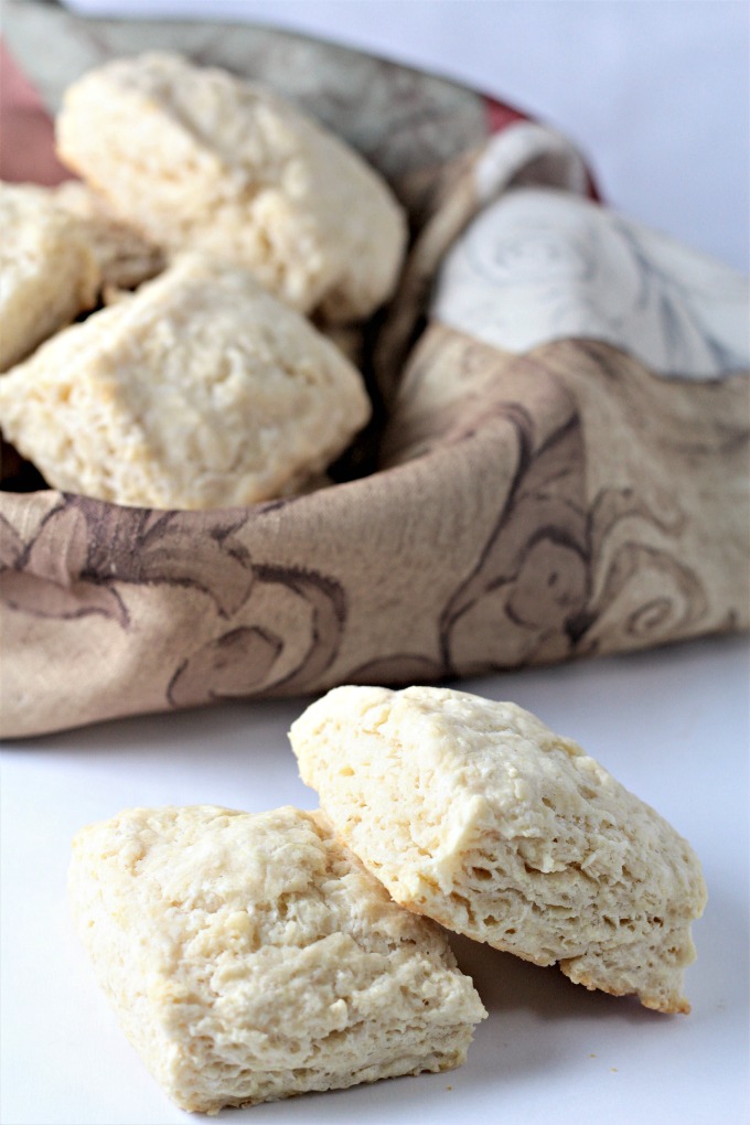 Super Easy Buttermilk Biscuits combine flour, buttermilk, grated butter, sugar, baking powder, baking soda and salt. Brush with milk and bake to perfection!