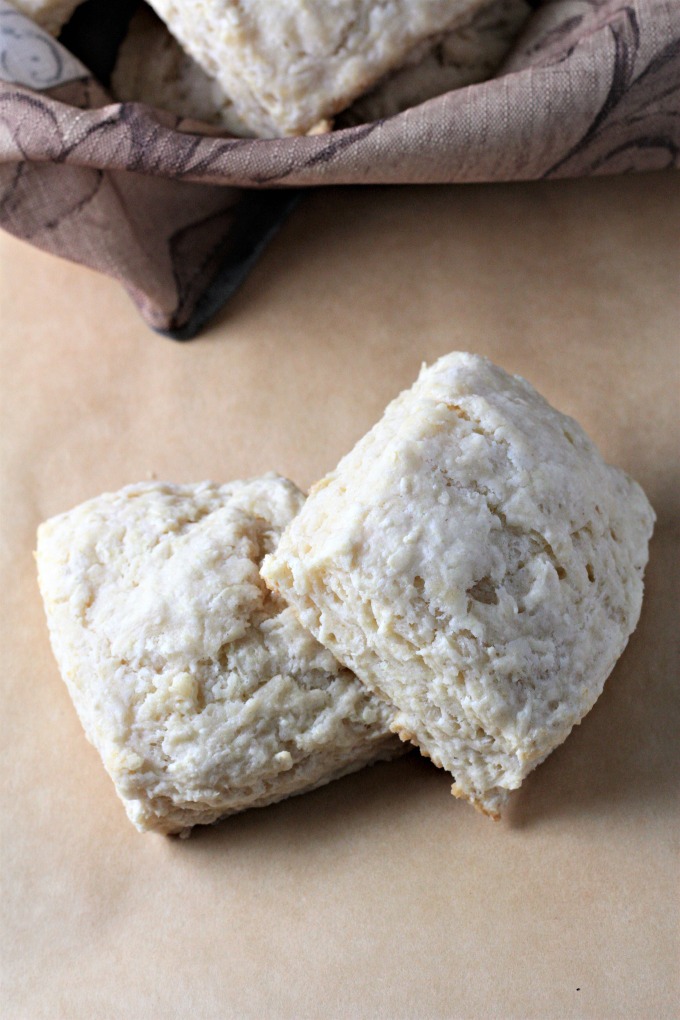 Super Easy Buttermilk Biscuits combine flour, buttermilk, grated butter, sugar, baking powder, baking soda and salt. Brush with milk and bake to perfection!