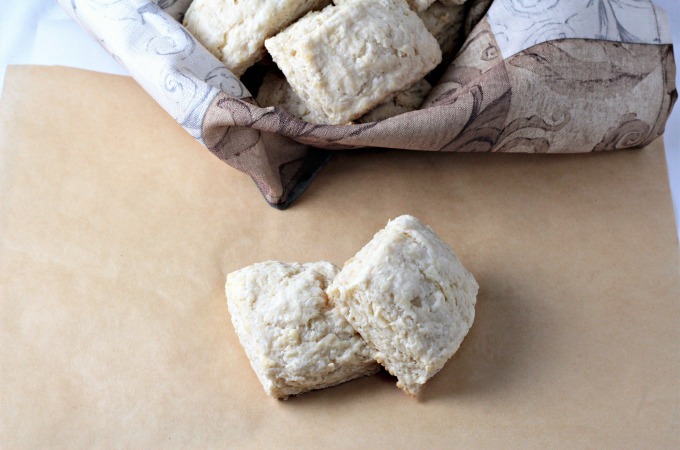 Super Easy Buttermilk Biscuits combine flour, buttermilk, grated butter, sugar, baking powder, baking soda and salt. Brush with milk and bake to perfection!