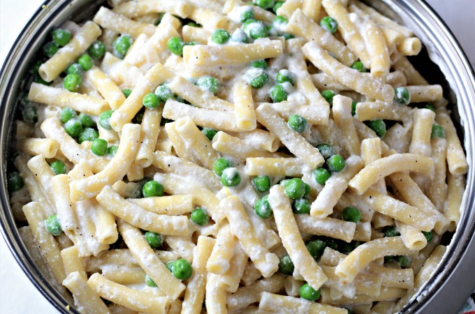 Pasta with Peas and Ricotta features olive oil, butter, ziti, chicken broth, Ricotta, Parmesan, frozen peas, lemon, shallots and garlic. 