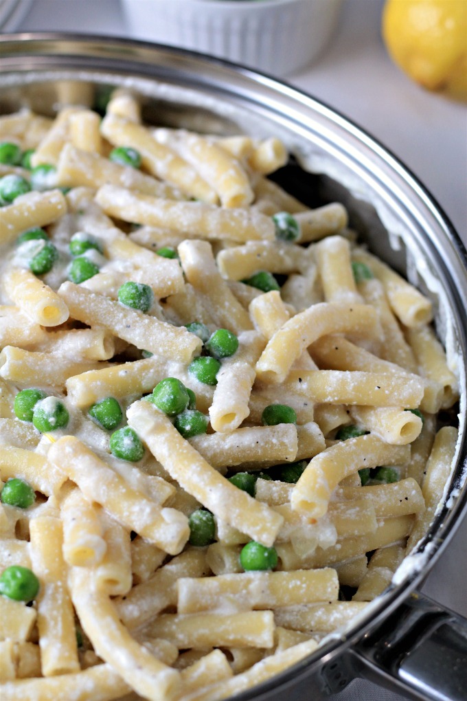 Pasta with Peas and Ricotta features olive oil, butter, ziti, chicken broth, Ricotta, Parmesan, frozen peas, lemon, shallots and garlic. 