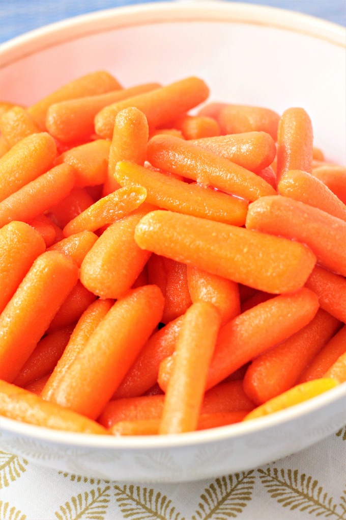 Honey Glazed Baby Carrots combine carrots, butter, and honey to make a delicious and healthy 3 ingredients vegetarian side dish the kids will love. 