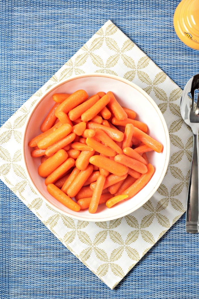 Honey Glazed Baby Carrots combine carrots, butter, and honey to make a delicious and healthy 3 ingredients vegetarian side dish the kids will love. 