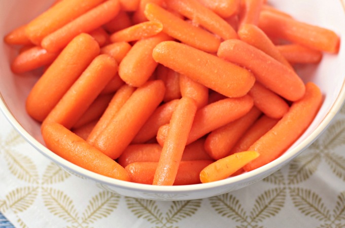 Honey Glazed Baby Carrots combine carrots, butter, and honey to make a delicious and healthy 3 ingredients vegetarian side dish the kids will love. 