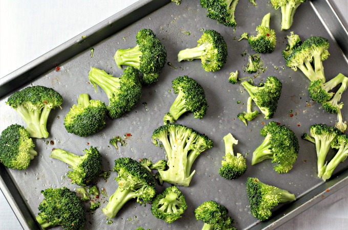 Italian Roasted Broccoli features broccoli tossed in Italian dressing, roasted to perfection and then topped with Parmesan cheese crumbles. So simple!