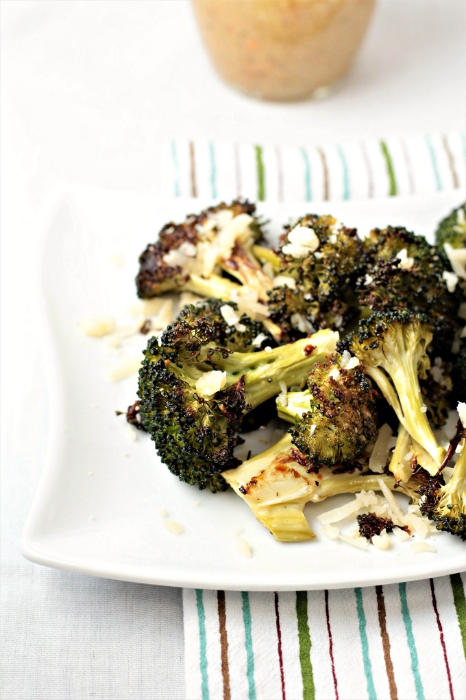 Italian Roasted Broccoli features broccoli tossed in Italian dressing, roasted to perfection and then topped with Parmesan cheese crumbles. So simple!
