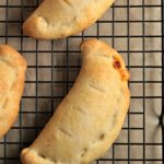 Chicken Calzones feature canned chicken, jar sauce, and Parmesan and mozzarella cheeses inside premade pizza crust to make a delicious and easy meal.