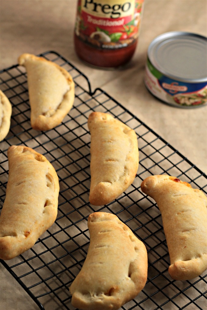 Chicken Calzones feature canned chicken, jar sauce, and Parmesan and mozzarella cheeses inside premade pizza crust to make a delicious and easy meal. 