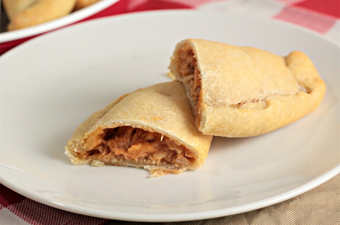 Chicken Calzones feature canned chicken, jar sauce, and Parmesan and mozzarella cheeses inside premade pizza crust to make a delicious and easy meal. 