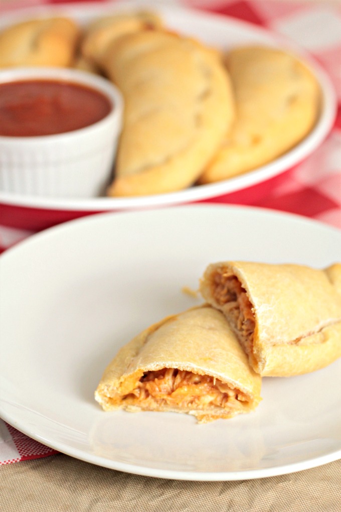 Chicken Calzones feature canned chicken, jar sauce, and Parmesan and mozzarella cheeses inside premade pizza crust to make a delicious and easy meal. 