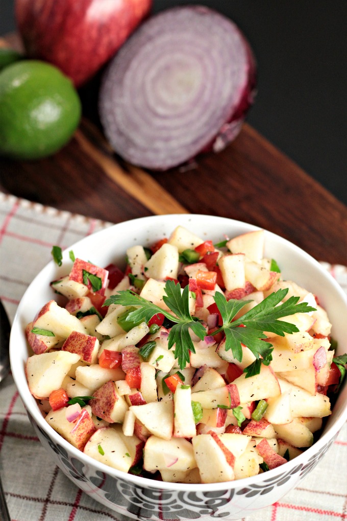 Spicy Grilled Pork Chops with Apple Salsa features marinated pork and an apple salsa made with fresh fruits and vegetables. Impressive and delicious!