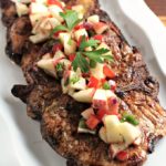 Spicy Grilled Pork Chops with Apple Salsa features marinated pork and an apple salsa made with fresh fruits and vegetables. Impressive and delicious!