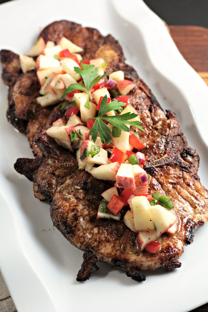 Spicy Grilled Pork Chops with Apple Salsa features marinated pork and an apple salsa made with fresh fruits and vegetables. Impressive and delicious!