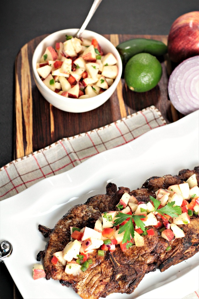 Spicy Grilled Pork Chops with Apple Salsa features marinated pork and an apple salsa made with fresh fruits and vegetables. Impressive and delicious!