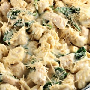 Chicken Spinach Tortellini Alfredo is chicken, jar sauce, milk, cheese tortellini, spinach and Parmesan cheese and is on the table in about 30 minutes!