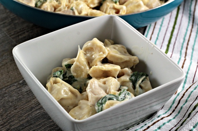 Chicken Spinach Tortellini Alfredo is chicken, jar sauce, milk, cheese tortellini, spinach and Parmesan cheese and is on the table in about 30 minutes!