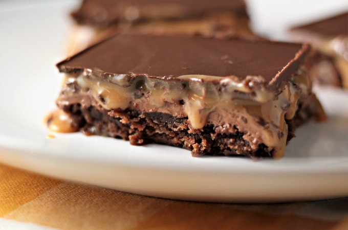 Milky Way Brownies feature boxed brownies topped with a layer of homemade nougat, a layer of caramel, and a layer of chocolate. A truly decadent treat!