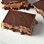 Milky Way Brownies feature boxed brownies topped with a layer of homemade nougat, a layer of caramel, and a layer of chocolate. A truly decadent treat!