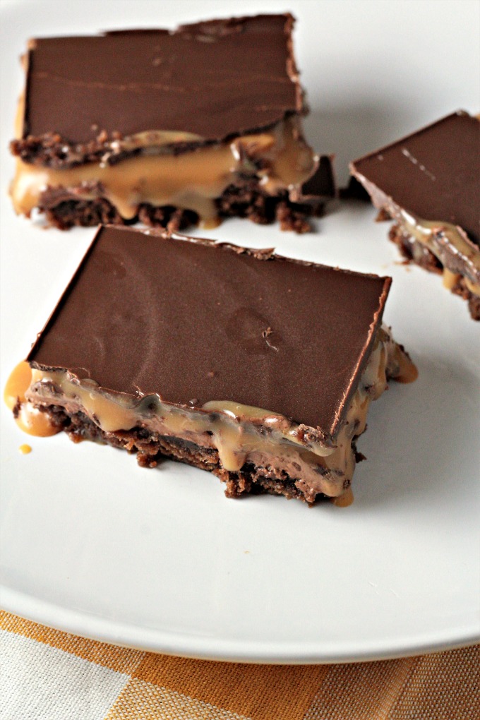 Milky Way Brownies feature boxed brownies topped with a layer of homemade nougat, a layer of caramel, and a layer of chocolate. A truly decadent treat!