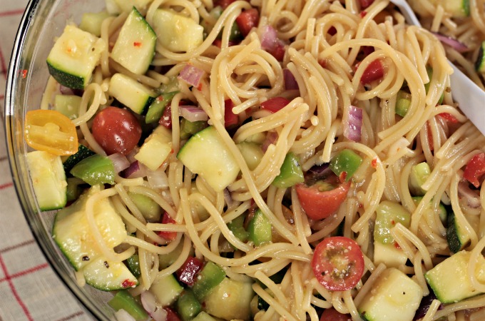 Garden-Fresh Spaghetti Salad: Spaghetti, zucchini, cucumber, red and green bell pepper, cherry tomatoes, red onion, Italian dressing and Parmesan cheese. 