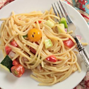 Garden-Fresh Spaghetti Salad: Spaghetti, zucchini, cucumber, red and green bell pepper, cherry tomatoes, red onion, Italian dressing and Parmesan cheese.