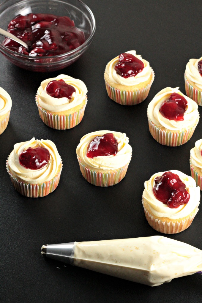 Strawberry Cheesecake Cupcakes transform a boxed white cake mix into a delicious treat with premade cheesecake filling and strawberry pie filling. So easy!