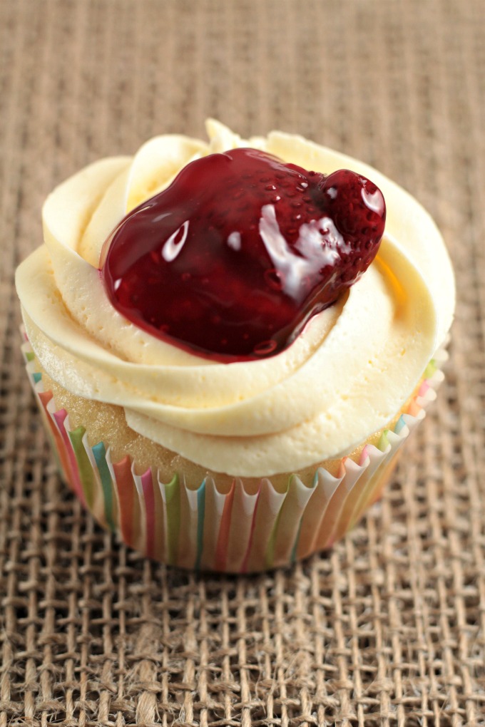 Strawberry Cheesecake Cupcakes transform a boxed white cake mix into a delicious treat with premade cheesecake filling and strawberry pie filling. So easy!